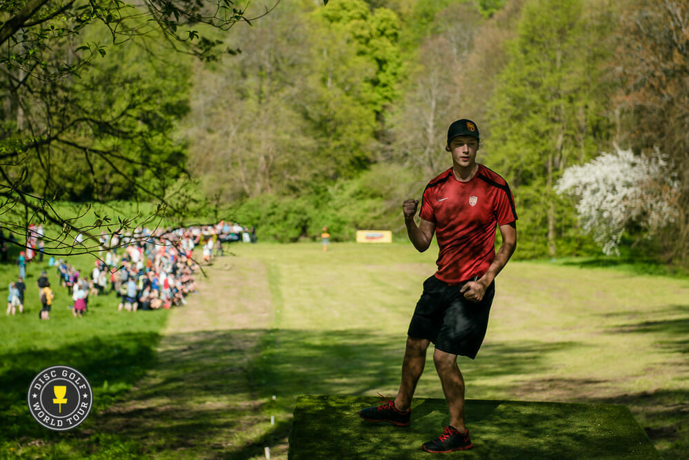 Simon Lizotte emerged atop the podium after a three-way playoff at the Konopiště Open. Photo: Eino Ansio, Disc Golf World Tour