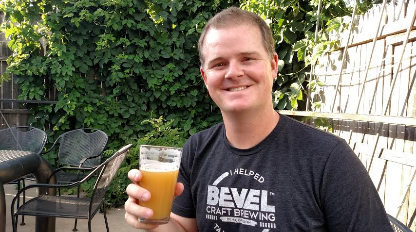 Nate Doss enjoys a pint in the beer garden at The Dive Bar in Worcester, Massachusetts.