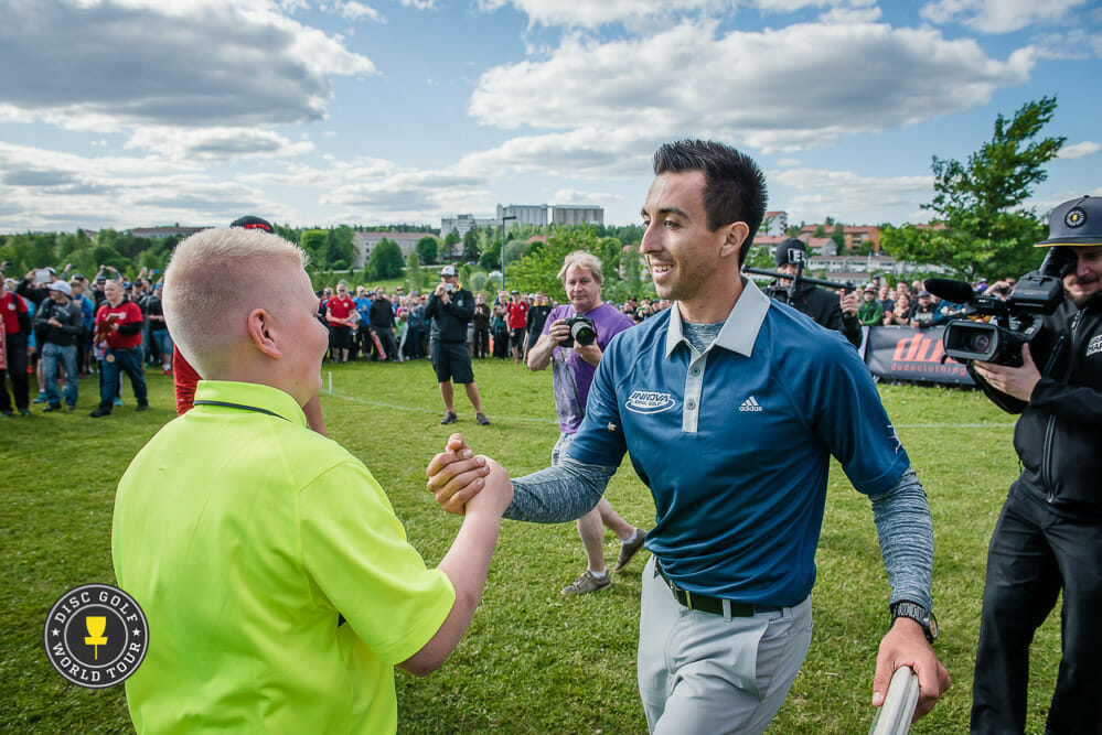 Paul McBeth celebrates with his caddy after coming back to win the European Open by two strokes. Photo: Eino Ansio, Disc Golf World Tour