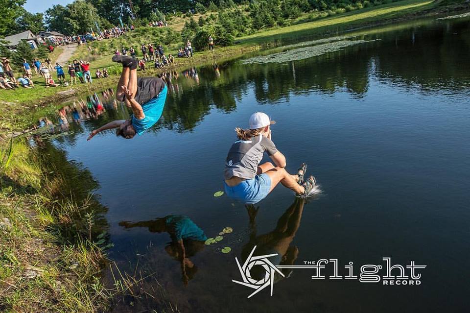 Bradley Williams (left) and Paige Pierce celebrate their Vibram Open victories with the traditional pond jump. Photo: Stu Mullenberg, The Flight Record