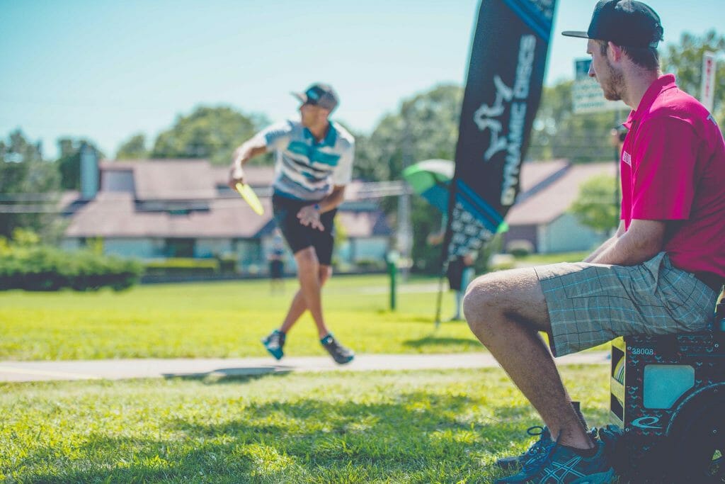 Ricky Wysocki looks on as Paul McBeth drives at the Emporia Country Club Thursday. Photo: Juan Luis Garcia, Overstable Studios