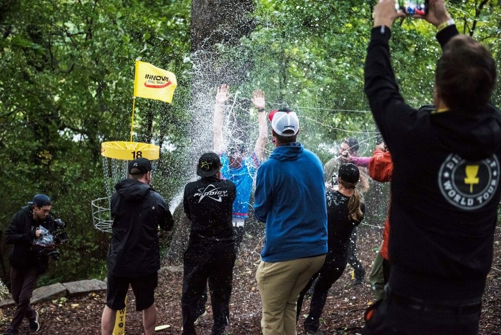 Jeremy Koling's friends teamed up to treat him to a champagne shower after an impromptu United States Disc Golf Championship celebration. Photo: Eino Ansio, Disc Golf World Tour